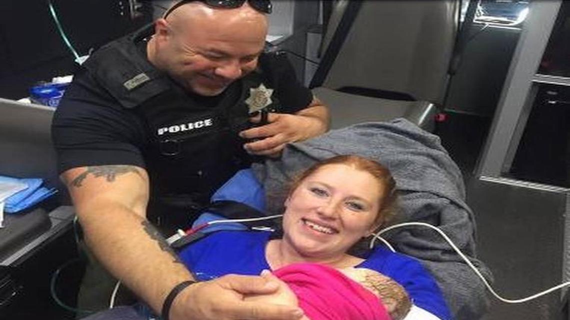 A picture of deputy constable Mark Diebold with Destiny Hall after he helped deliver her baby was seen worldwide.