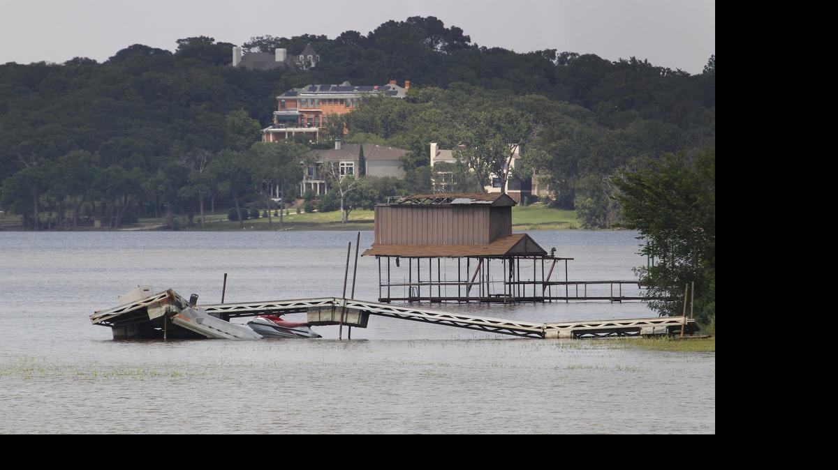 
A neighboring dock near the home of Chris Allen was left mangled from a steady onslaught of thunderstorms and flooding at Lake Arlington.
