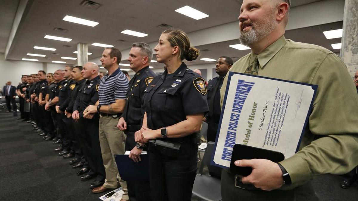 Matt Pearce stands with officers who responded to his shooting and helped save his life. The Fort Worth Police Department honored officers Thursday night for actions and deeds from 2016. The highlight honor of the night was to award the department’s Medal of Honor to Matt Pearce, who was shot five times in March.