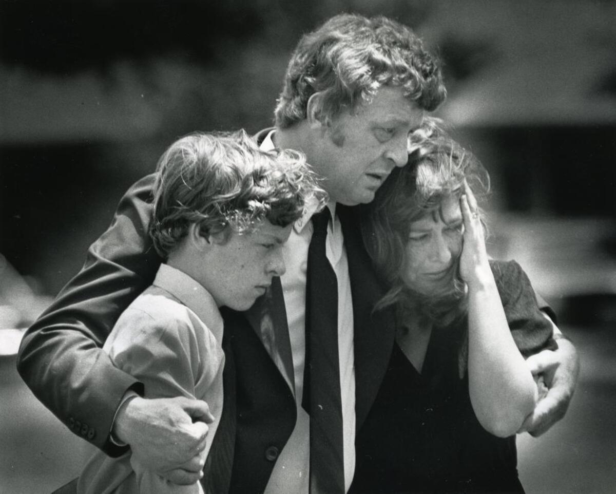 Lee, Colin and Janet Fuller at Julie Fuller’s graveside service in 1983.