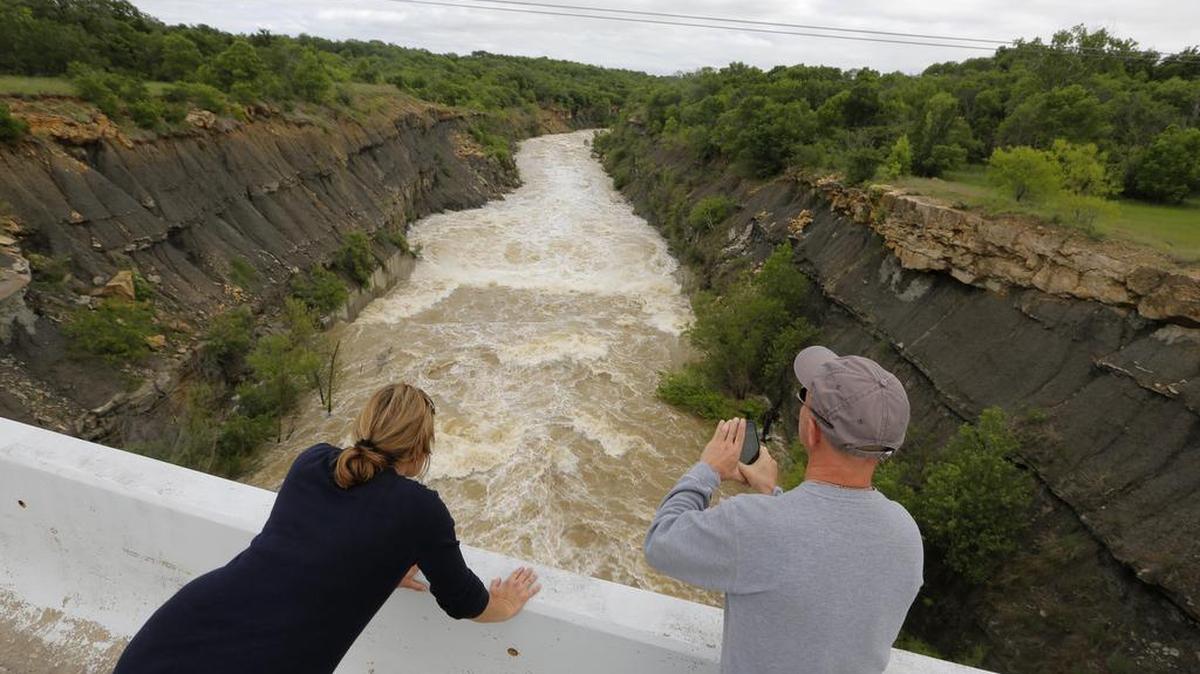 Last month, Judy and Kent Hamilton, of Boyd, watched water being released from the floodgates at Lake Bridgeport. If the rain holds off, lake levels should continue to drop this week.