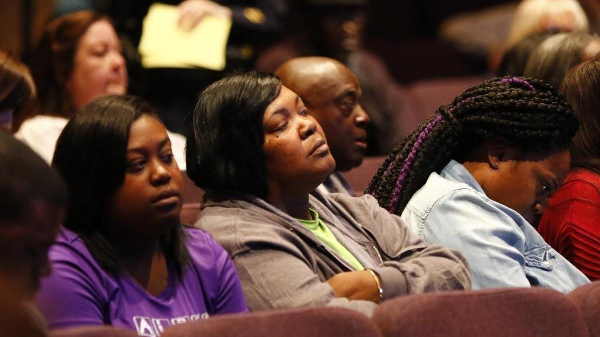 Jacqueline Craig, center, listens in the audience at a community meeting with Fort Worth city and police leaders a few weeks after her arrest in January 2017.