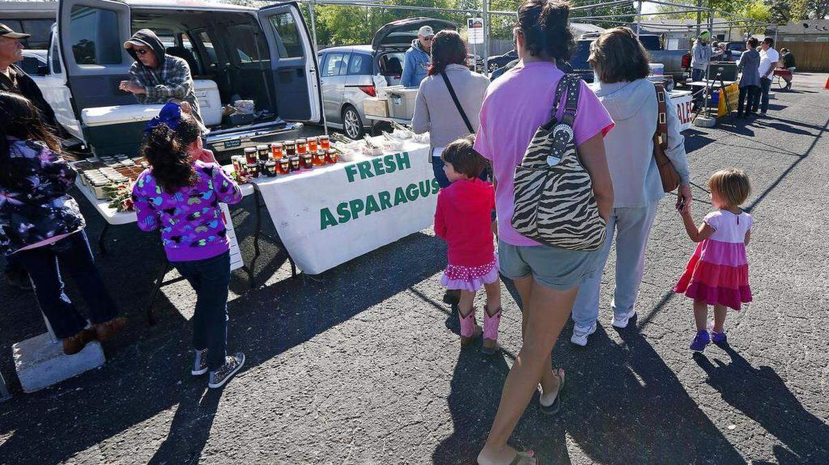 Shoppers browse at the Cowtown Farmers Market in Fort Worth.