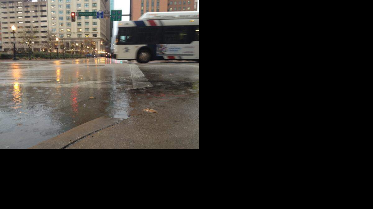 
Rain puddles form at the corner of Throckmorton and 7th Street in downtown Fort Worth on Monday morning. The showers should be gone by the lunch hour.
