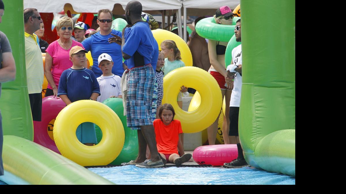 
Mayor Betsy Price, in pink, was among those who did not get to go down a malfunction water slide Saturday morning at PantherFest, just north of downtown Fort Worth.
