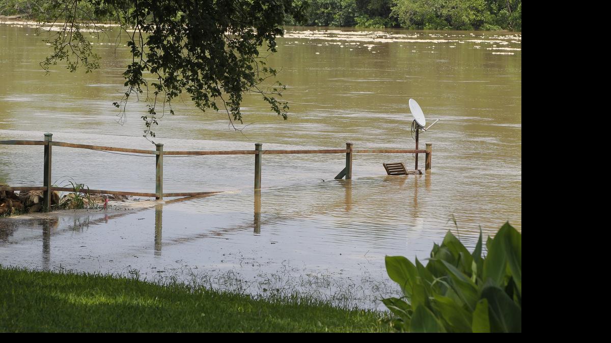 
A fence is overtaken by the rising Brazos River in Horseshoe Bend on Wednesday, May 27, 2015. The river is expected to reach flood stage on Thursday.

