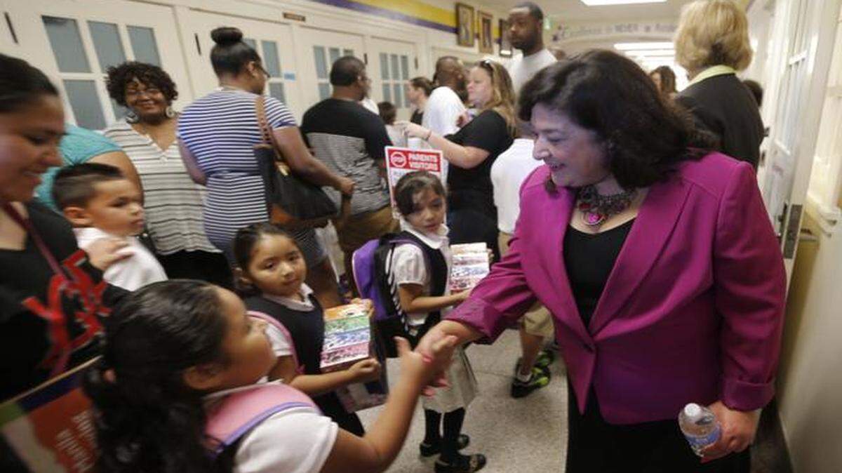 
Interim Superintendent Pat Linares greets parents and students as they arrive for the first day of school at Morningside Elementary School on Aug. 25. 
