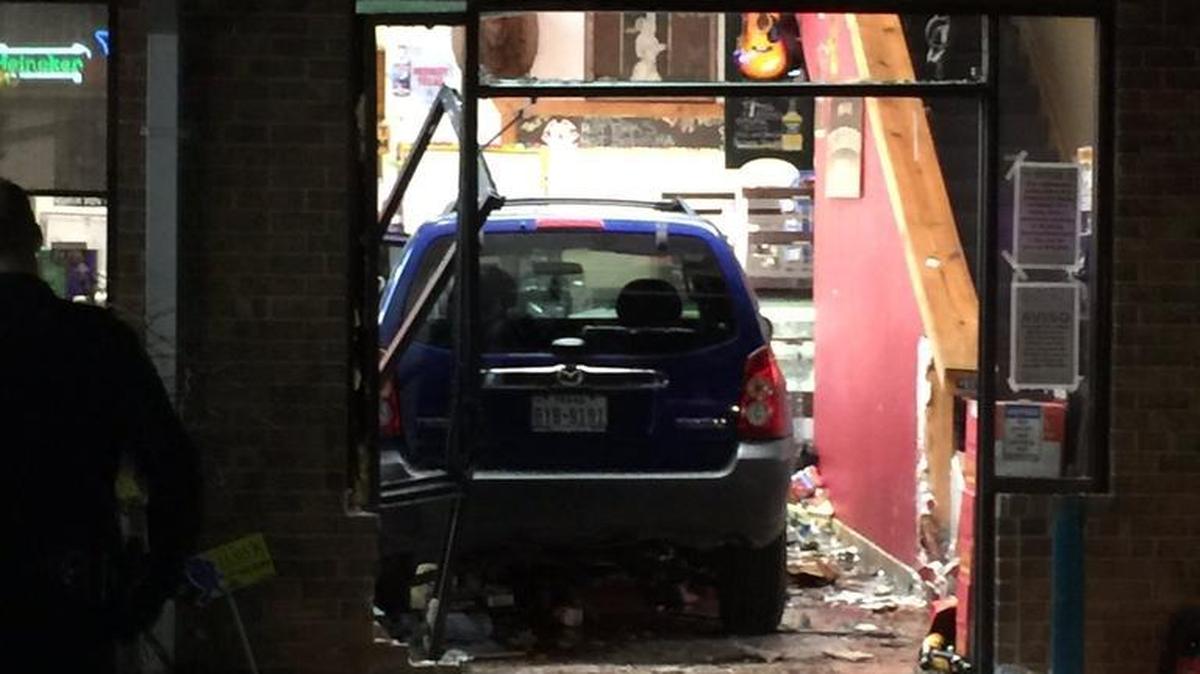 A SUV drove through the front of Hall’s Wine & Spirits in Colleyville Thursday.