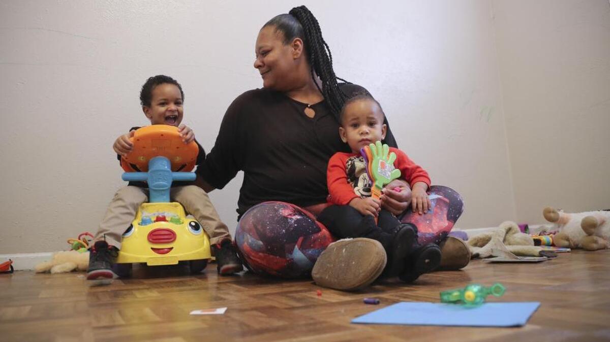 Sharoan Garrett plays with her children Xavier, 3, and Sy’ria, 19 months. They were among Tarrant County’s fastest-growing homeless segment until recently.