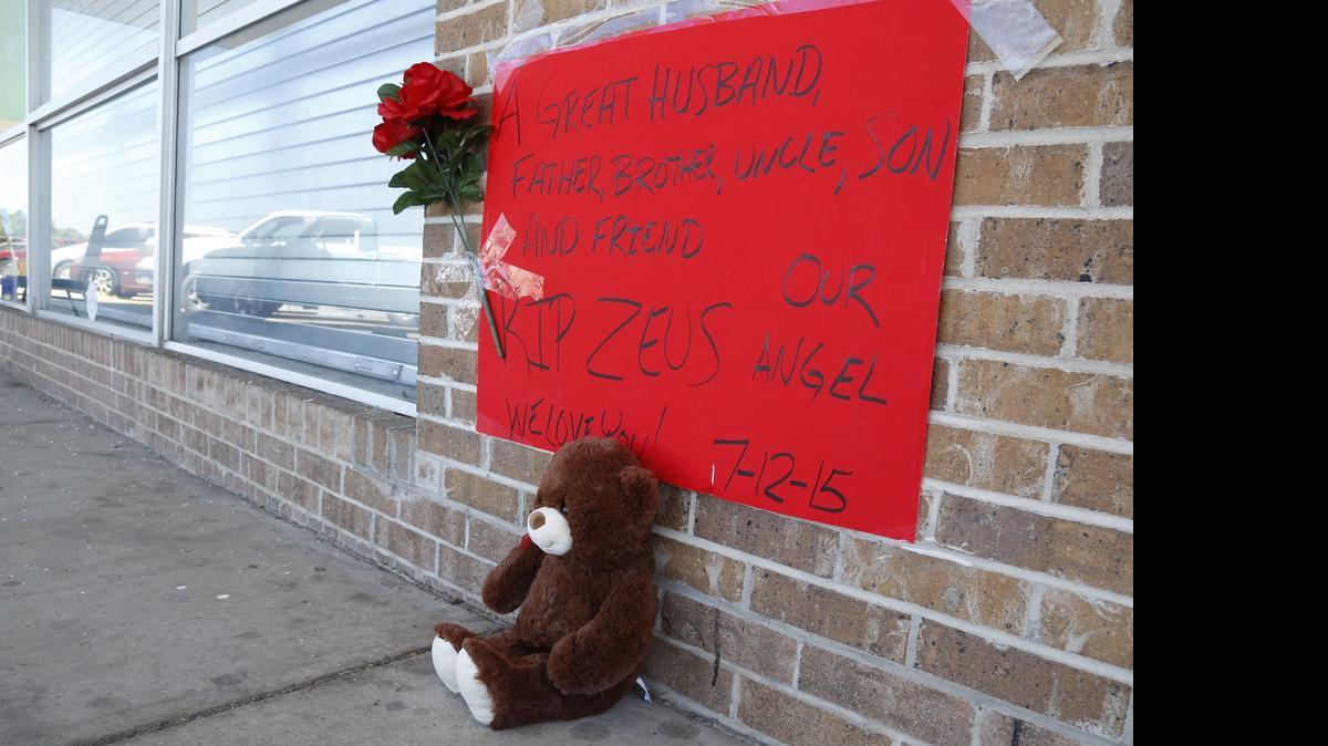 
A teddy bear sits where Aldwin Brown, 26, was killed July 12 when shots were fired into a crowd outside the Liquorville after-hours club in South Hills in Fort Worth.

