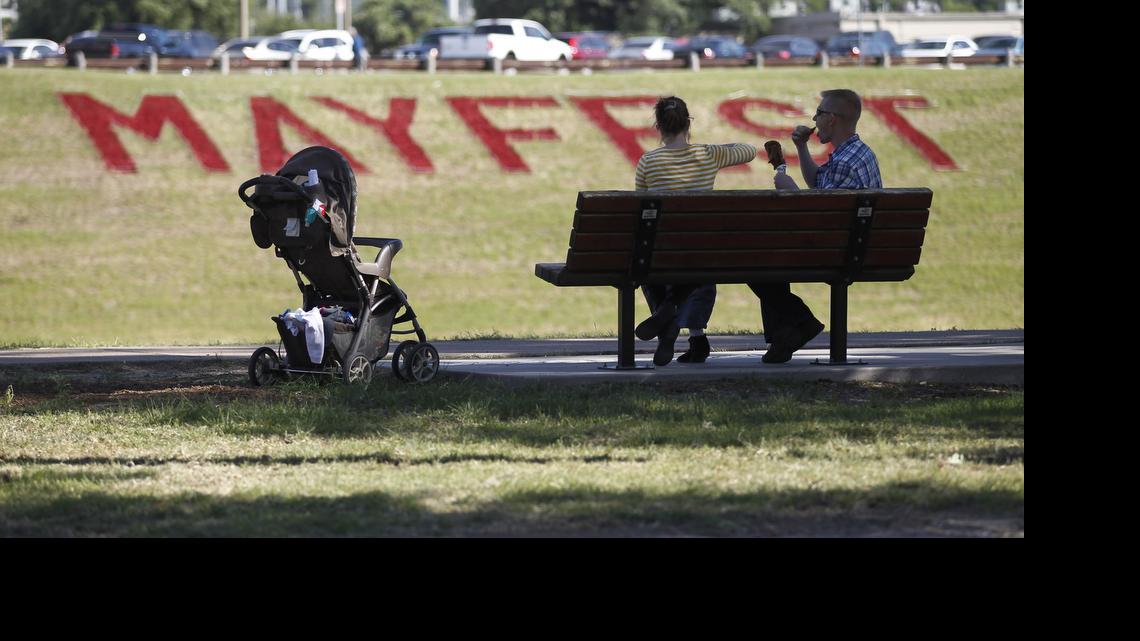 
Festivalgoers have a snack at Mayfest in Trinity Park in Fort Worth in 2013.
