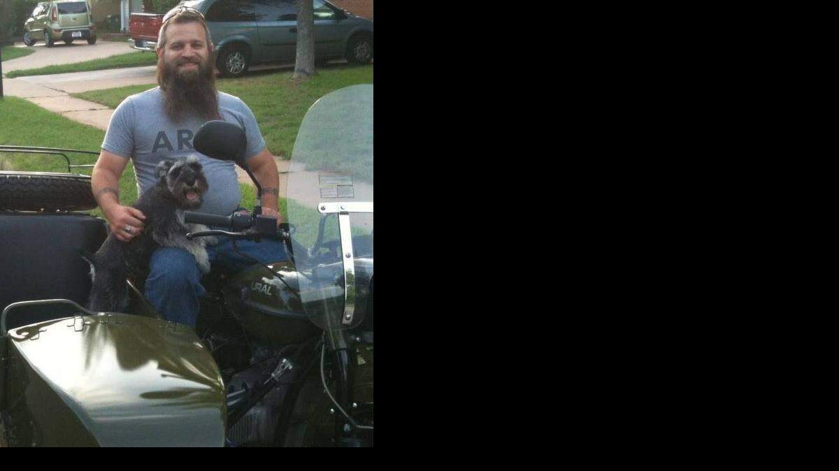 
Eric Peterson, 32, with his dog, Trigger. Peterson was fatally shot Saturday night while working at the Military Gun Supply store at 2901 S. Cravens Road.
