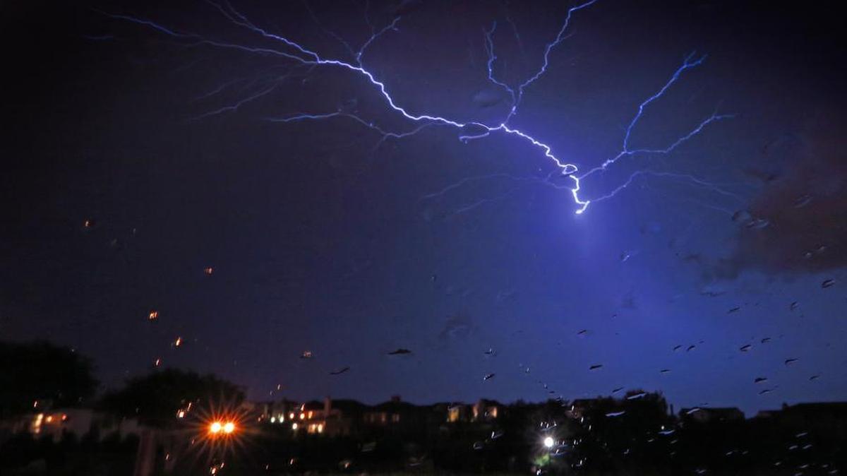 
Lightning arcs to the ground in a four-second time exposure as storms pass through southwest Fort Worth Tuesday night, May 26, 2015. 
