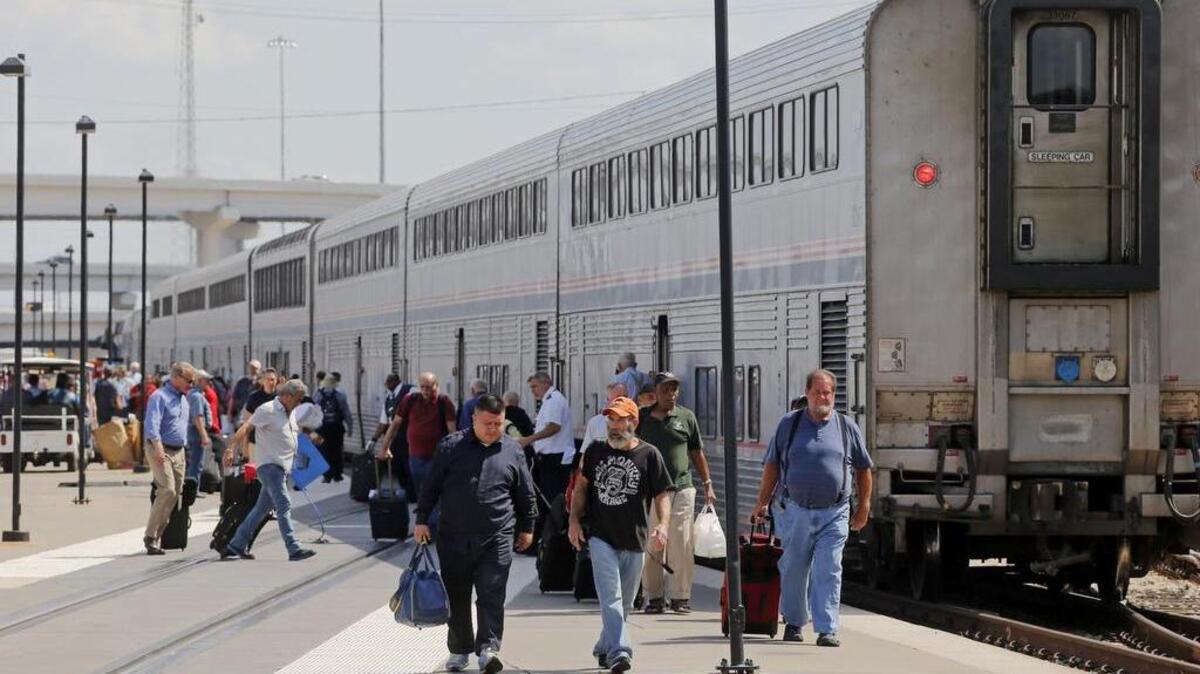 
Passengers exit the Texas Eagle, from San Antonio, at the Amtrak Station in Fort Worth.

