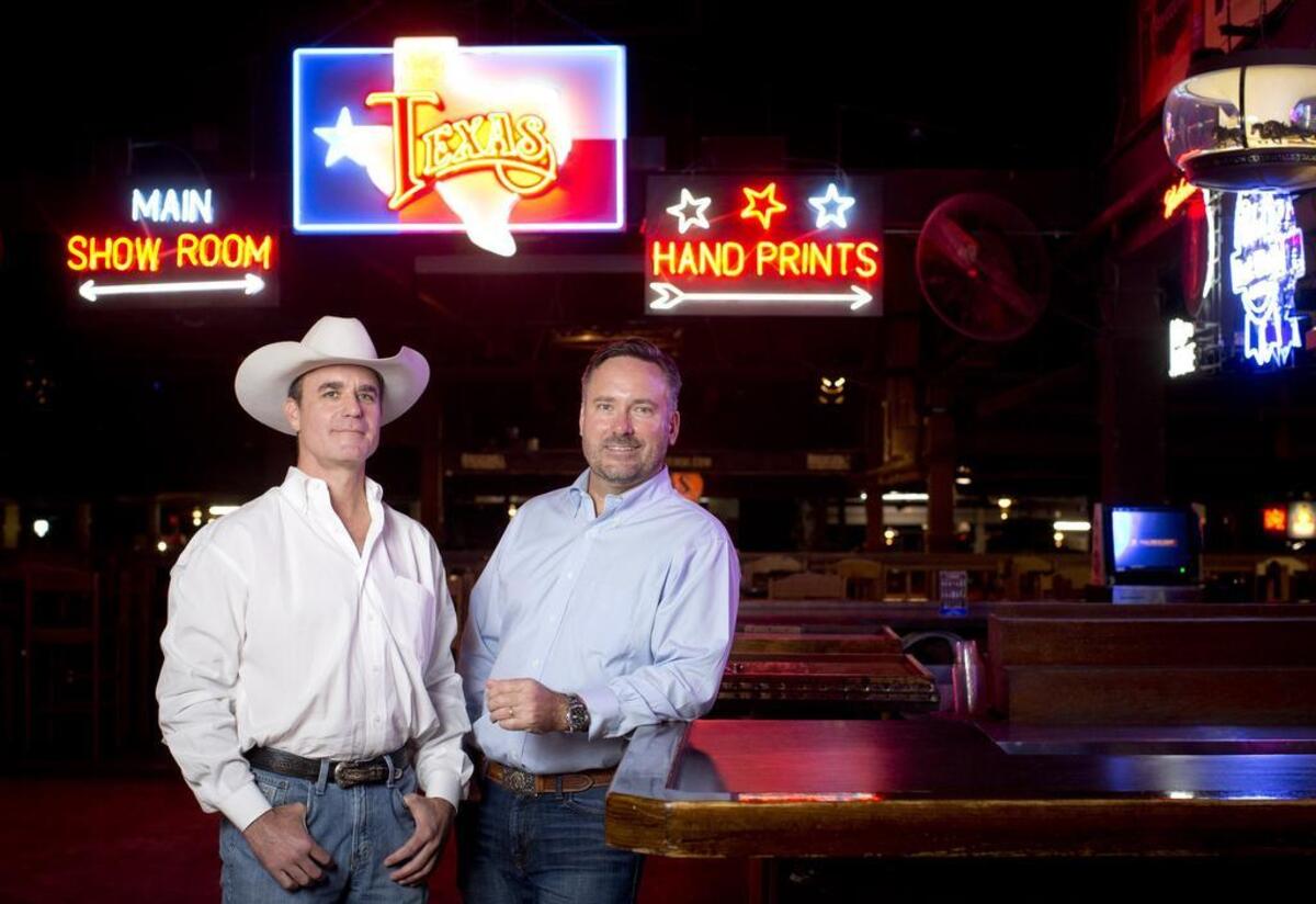 Philip Murrin and Concho Minick at Billy Bob's Texas. Minick and Murrin were among the investors who sued their partners when there was an attempt to fire Minick.