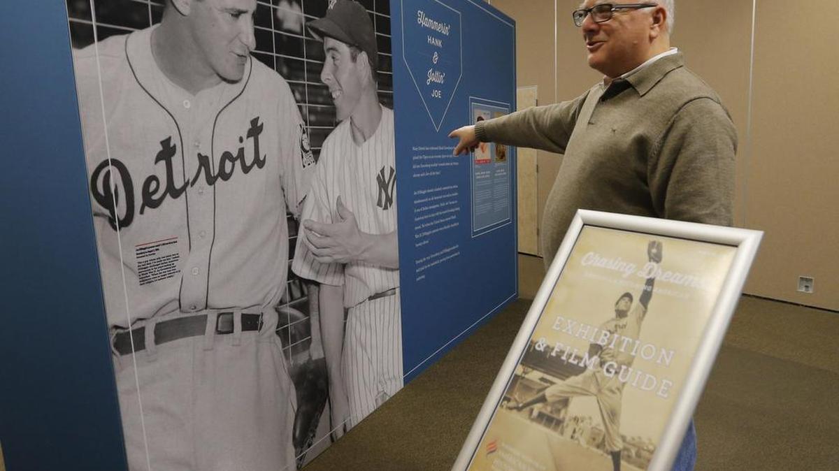 Rich Hollander walks through a baseball exhibit called ‘Chasing Dreams: Baseball and Becoming American’ at Congregation Ahavath Sholom on Wednesday.