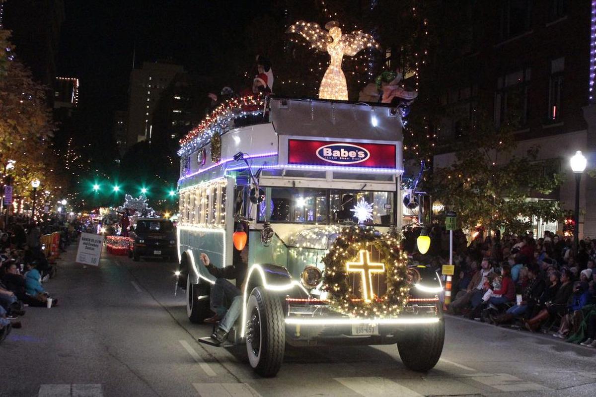 The Babe’s Chicken Dinner House Bus parades up Houston Street during the 2017 Parade of Lights