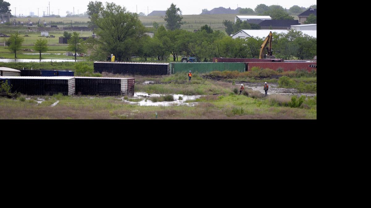 
Intermodal containers were strewn across the ground after being blown off a train car just north of Haslet on Sunday.
