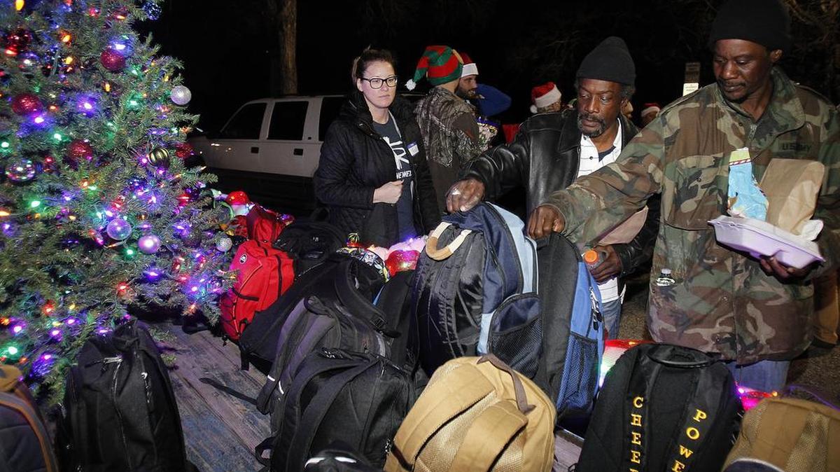 Love and Light Ministries in Fort Worth took a Christmas tree to five places where homeless people congregate. The people got to choose gifts of backpacks stuffed with useful items. This stop was in Glenwood Park in Fort Worth on Tuesday, Dec. 22, 2015.