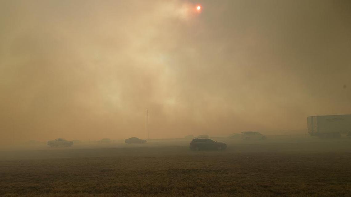 Smoke obscures the view of motorists on Interstate 20 on Jan. 22 as grass and weeds burn just north of the highway.