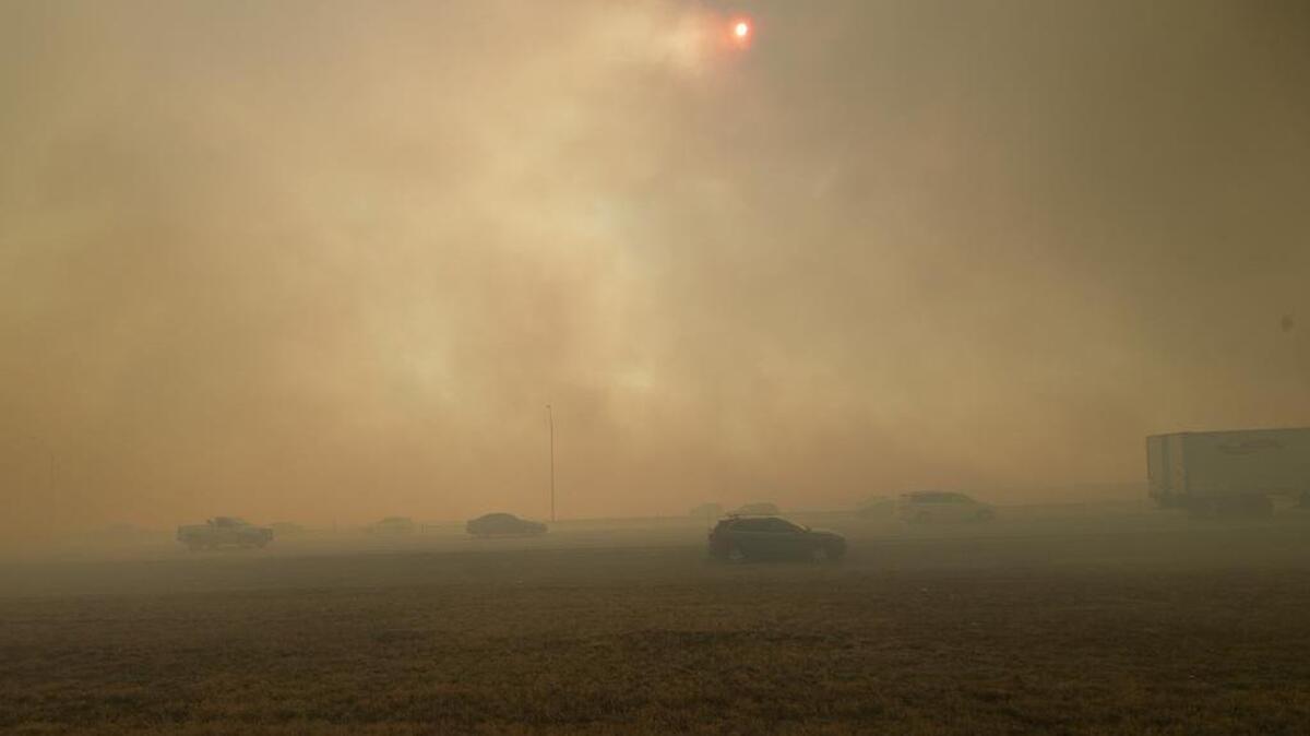 Smoke obscures the view of motorists on Interstate 20 on Jan. 22 as grass and weeds burn just north of the highway.