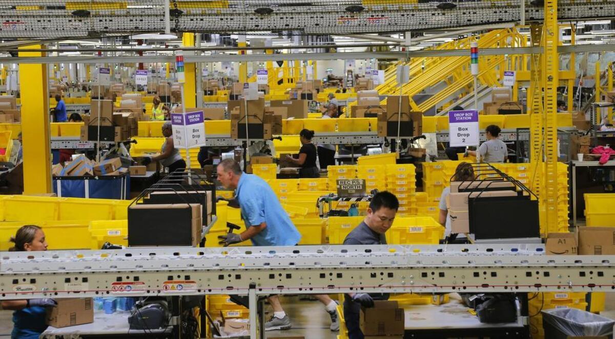 Associates prepare boxes for shipping as employees fill orders at Amazon Fulfillment Center in Haslet earlier this year. North Texas cities plan to submit a bid for landing a second Amazon headquarters by Thursday’s deadline.