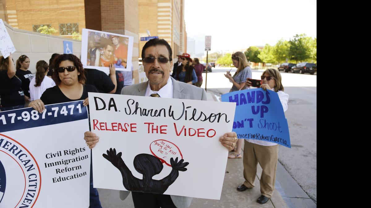 
Lee Salidivar, a member of LULAC, protests for the release of police video related to the shooting of Ruben Garcia Villalpando by a police officer during a protest at the Tim Curry Criminal Justice Center on April 15. 
