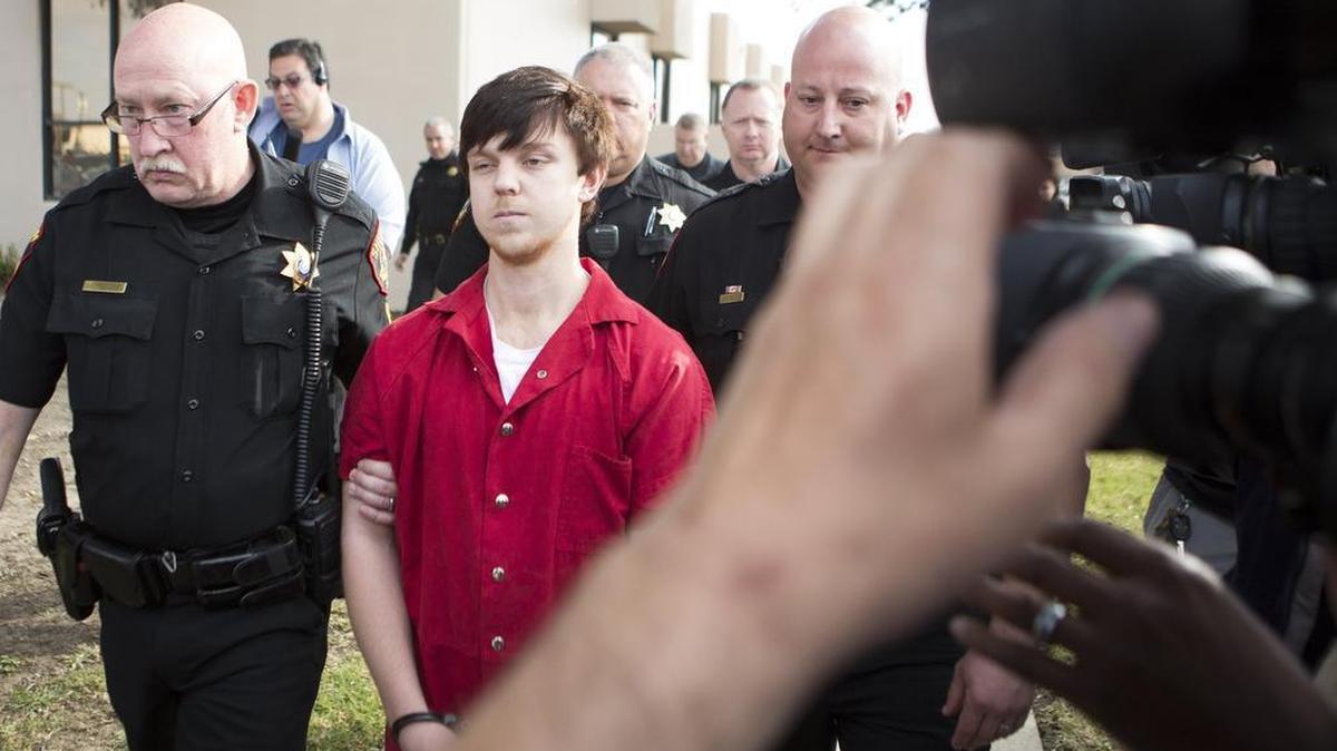 Ethan Couch is escorted out of the Scott D. Moore Juvenile Justice Center after his motion-to-transfer hearing Feb. 19, 2016, in Fort Worth.