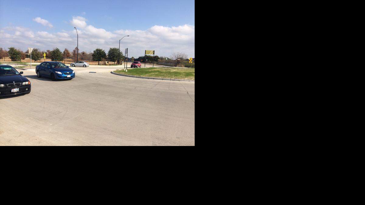 
Cars drive through the roundabout at Old Denton and Shiver roads in North Fort Worth.
