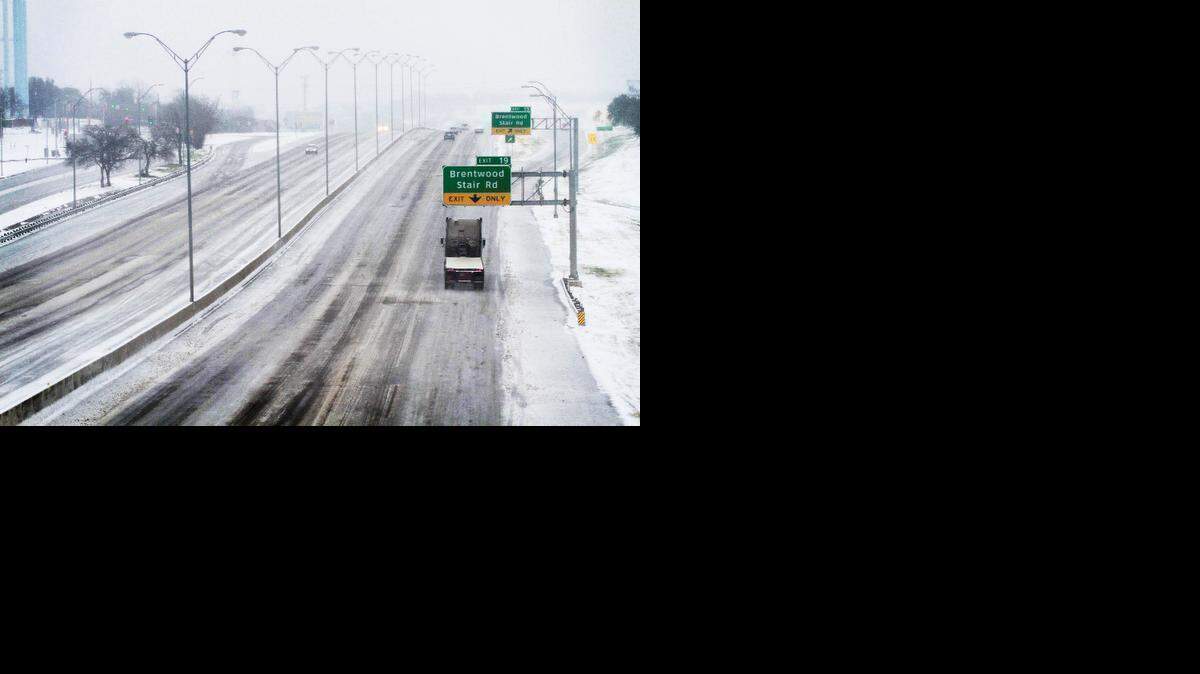 
Drivers navigate icy conditions on eastbound I-30 near Brentwood Stair Road in Fort Worth on Saturday morning, Feb. 28, 2015. 
