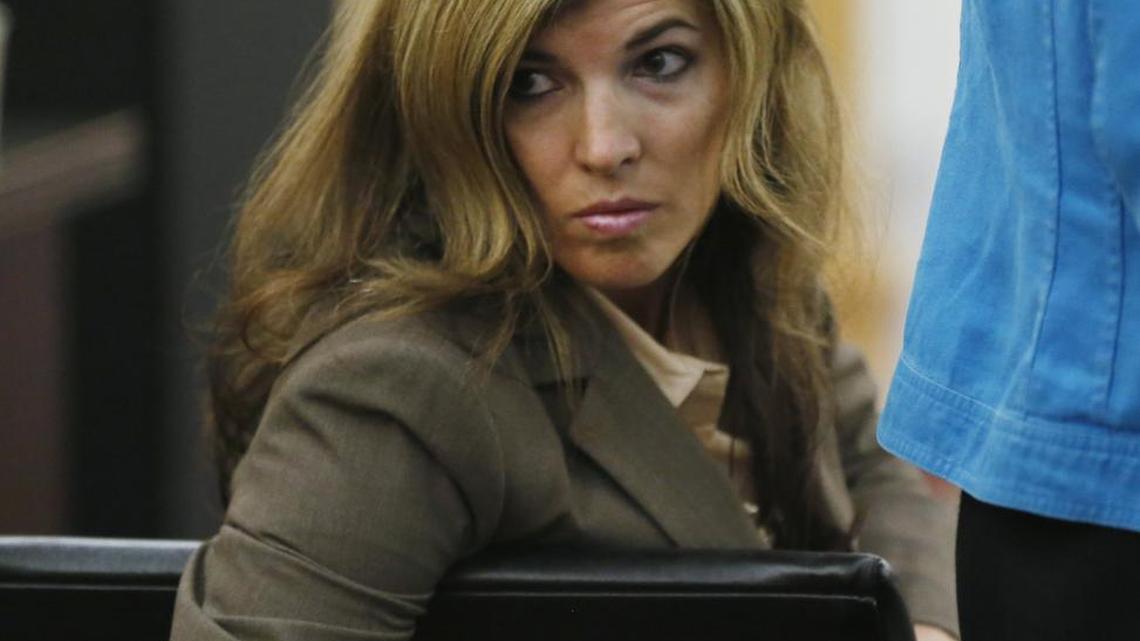 Danita Tutt looks to family and friends during an August bond hearing in which she was granted supervised visits with her sons.