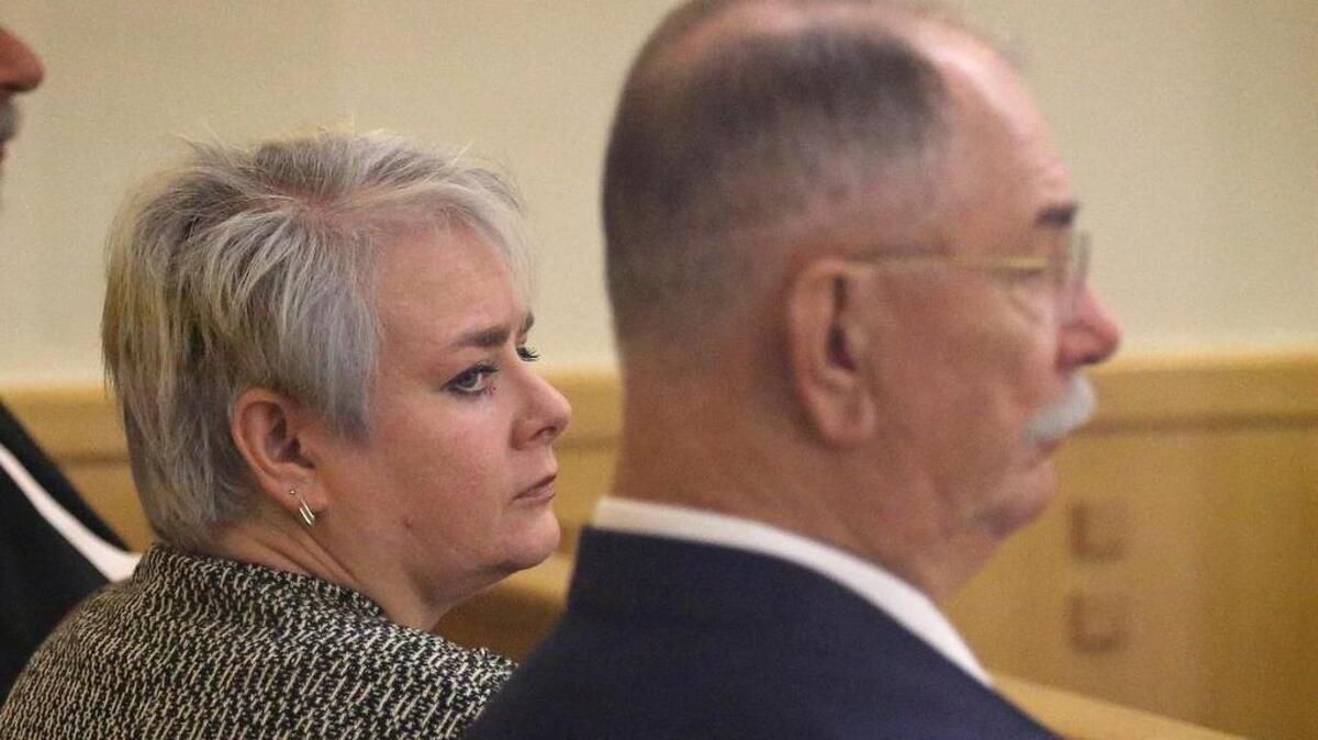 
Tabby Martinjak, left, and her father Mike Garvin, right, listen to testimony Monday in a sentencing hearing. They were each sentenced Tuesday to 20 years in prison on a charge of injury to the disabled in the case of Garvin’s daughter and Martinjak’s sister Marci Garvin, a severely disabled woman who died at 39.

