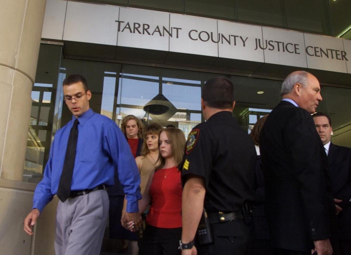Brandon Biggs, left, led his family out of the Tarrant County Justice Center to read a statement after the woman who killed his father was sentenced to 50 years in prison.