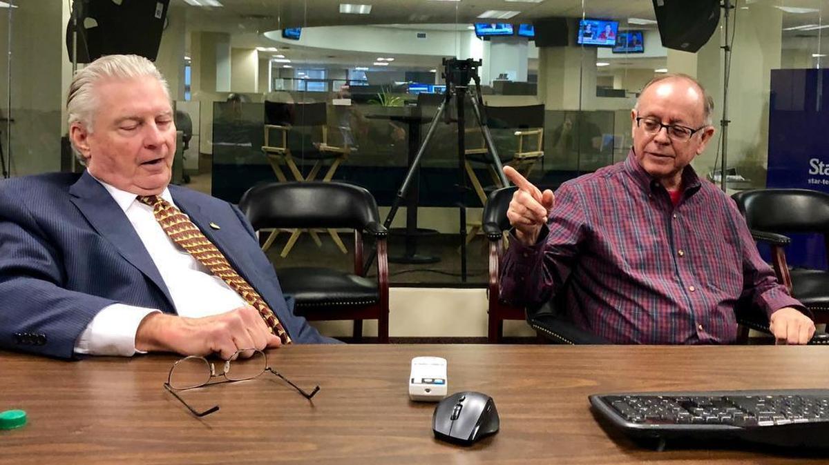District Clerk Tom Wilder, left, and challenger Frank Palomino Jr. exchange words during a recent Star-Telegram Editorial Board meeting.