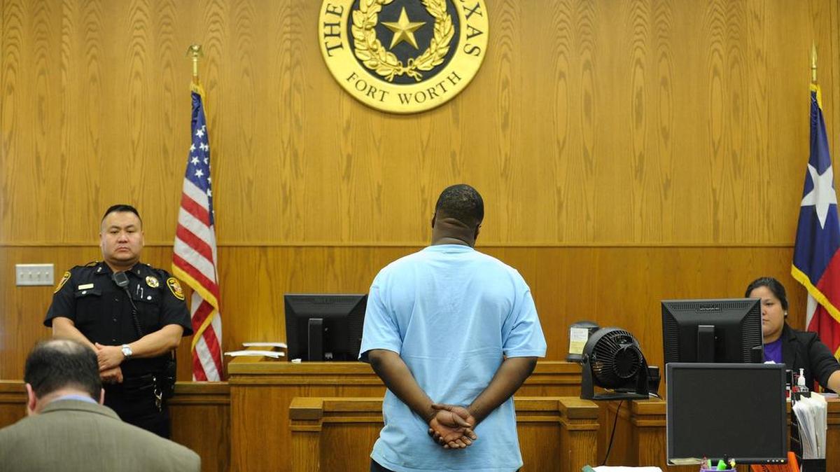 A defendant stands in front of Municipal Court Judge Neel McDonald. A new system allows jurors to perform some jury-related functions online, beginning this week.