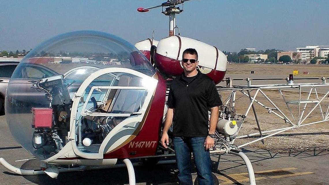 Bell Helicopter pilot Jason Grogan in an undated family photo stands in front of a Bell 47G helicopter. Grogan was one of two Bell test pilots killed Wednesday, July 6, 2016, when a Bell 525 prototype crashed in southern Ellis County.