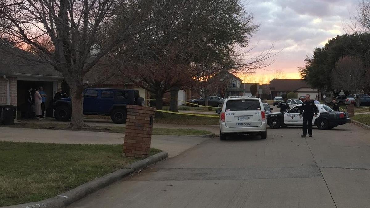 A Fort Worth police car blocks traffic in the 4600 block of Birchbend Lane after a man was fatally shot Tuesday.
