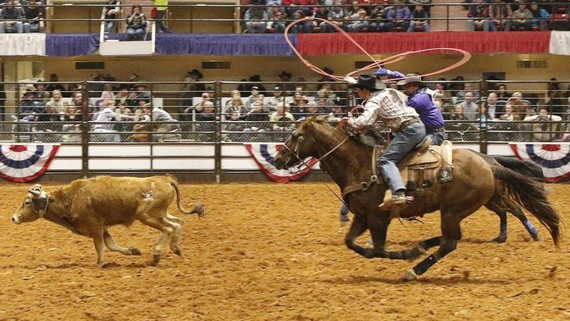 The duo of Matt Sherwood and Walt Woodard compete in Team Roping during the 100th anniversary of the first indoor rodeo at the Fort Worth Stock Show and Rodeo on Feb. 3, 2018.