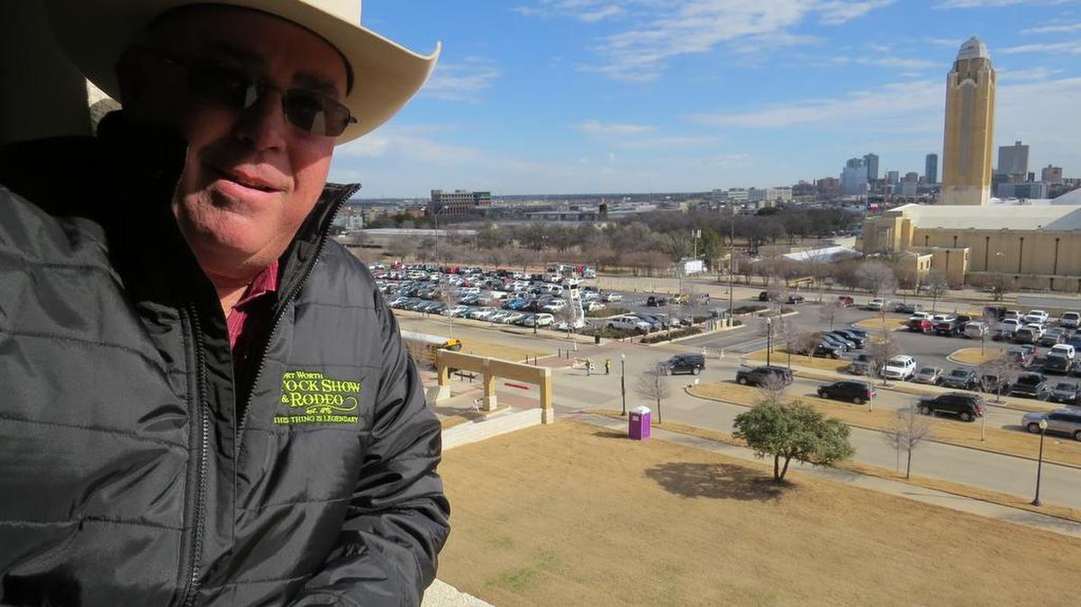 Retired Fort Worth police officer Paul Davis oversees the 100 or so workers who coordinate the “ballet” that gets folks into parking spaces at the Fort Worth Stock Show and Rodeo.