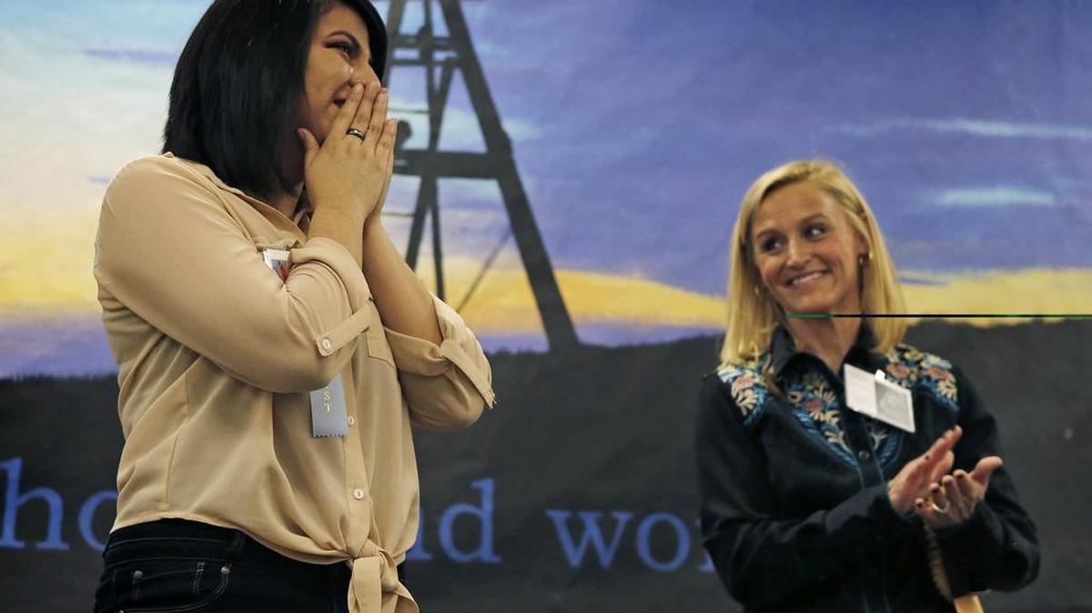 Realizing she is the last person onstage and therefore the grand champion, Daniela Cortes begins to cry. Guns and Roses Committee member Demar Sciuto is at right. The annual awards for the Star-Telegram-sponsored Stock Show Art Contest were held Saturday.