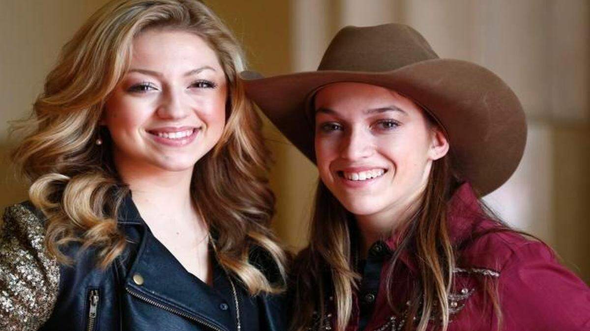 
Abbey Cone, 16, left,  sang the national anthem at Wednesday’s rodeo;  her sister Darby Cone, 18,  is a barrel racer who rode in the grand entry. 
