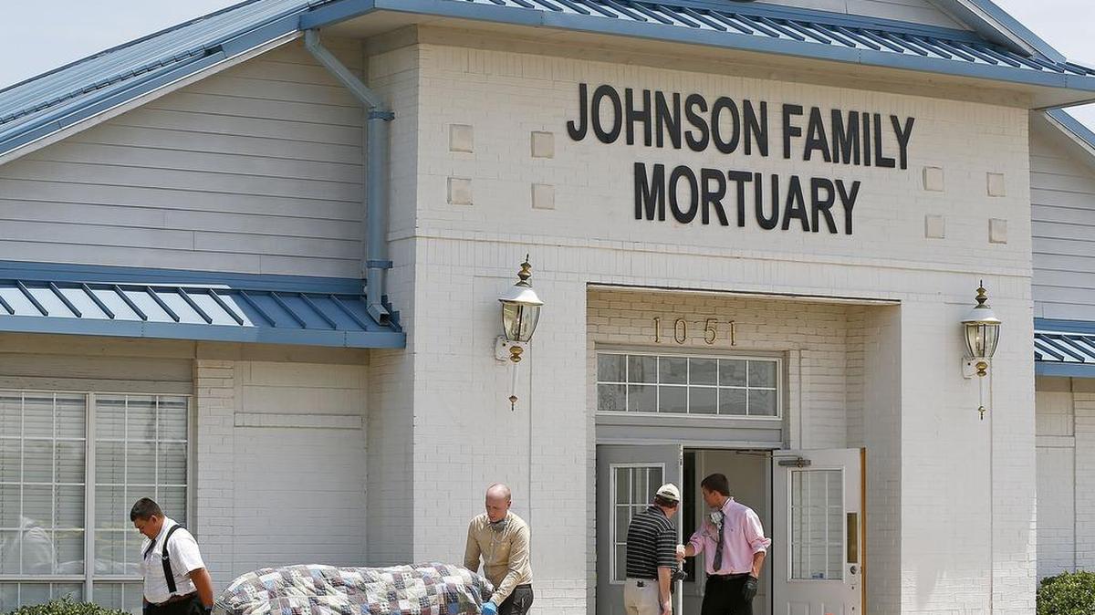 
Bodies in various stages were removed from the Johnson Family Mortuary in July 2014.
