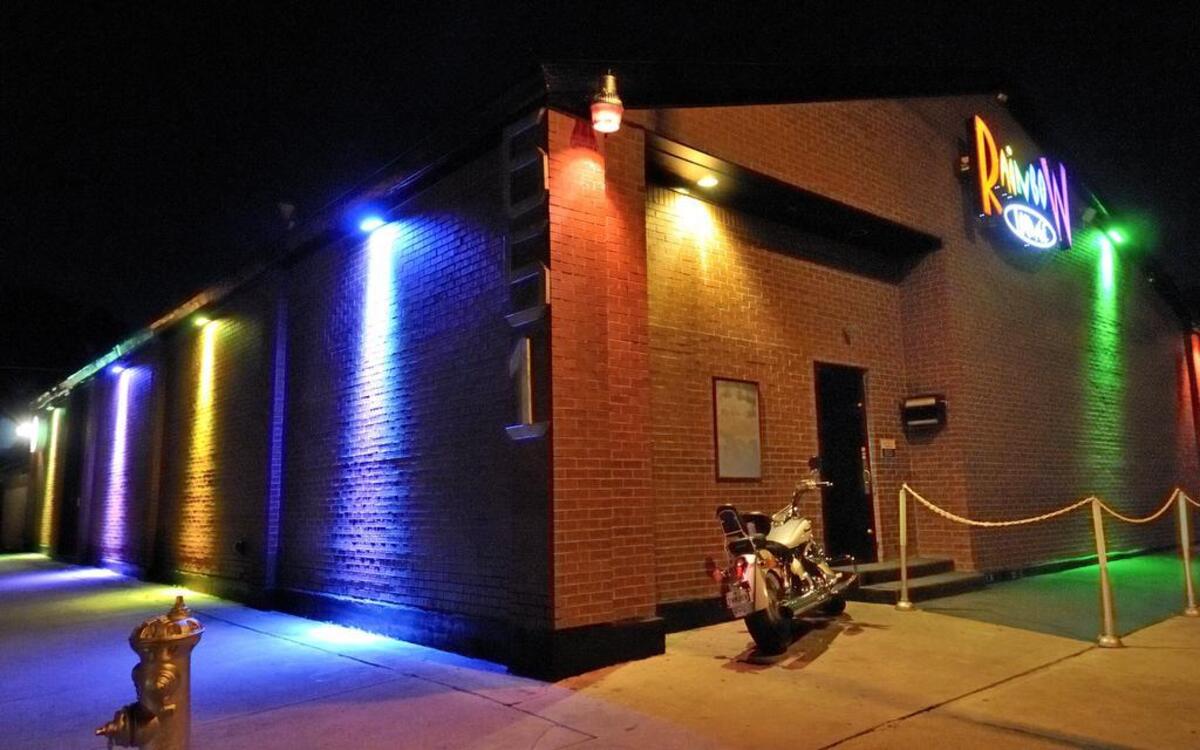 Exterior photo of the Rainbow Lounge at night.