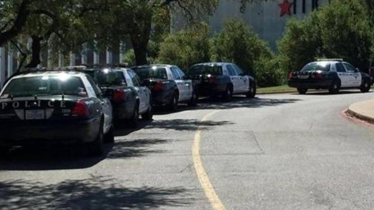 Fort Worth patrol cars line up outside Macy’s Saturday as officers arrive to search for an armed suspect. Suspect Vernon Hassell was later found in a boiler room at Macy’s.