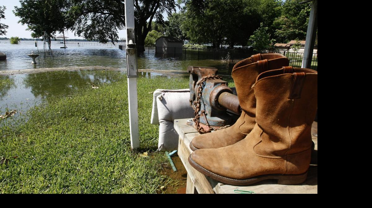 
Floodwaters threatened a pair of boots and homes along Lake Worth on Tuesday.
