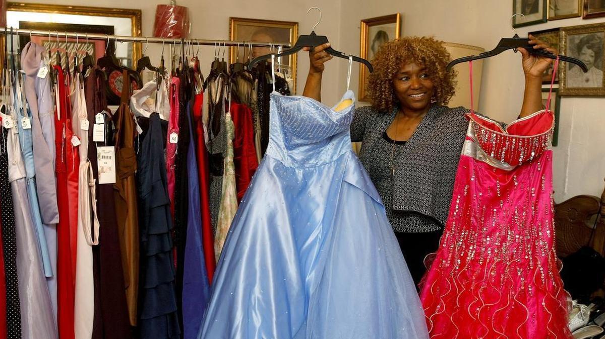 Sandra Russell shows some of the dresses available to Tarrant County high school seniors at the Fort Worth Association of Federated Women’s Clubs prom dress giveaway in Fort Worth. The event is Saturday and Sunday, March 19-20.