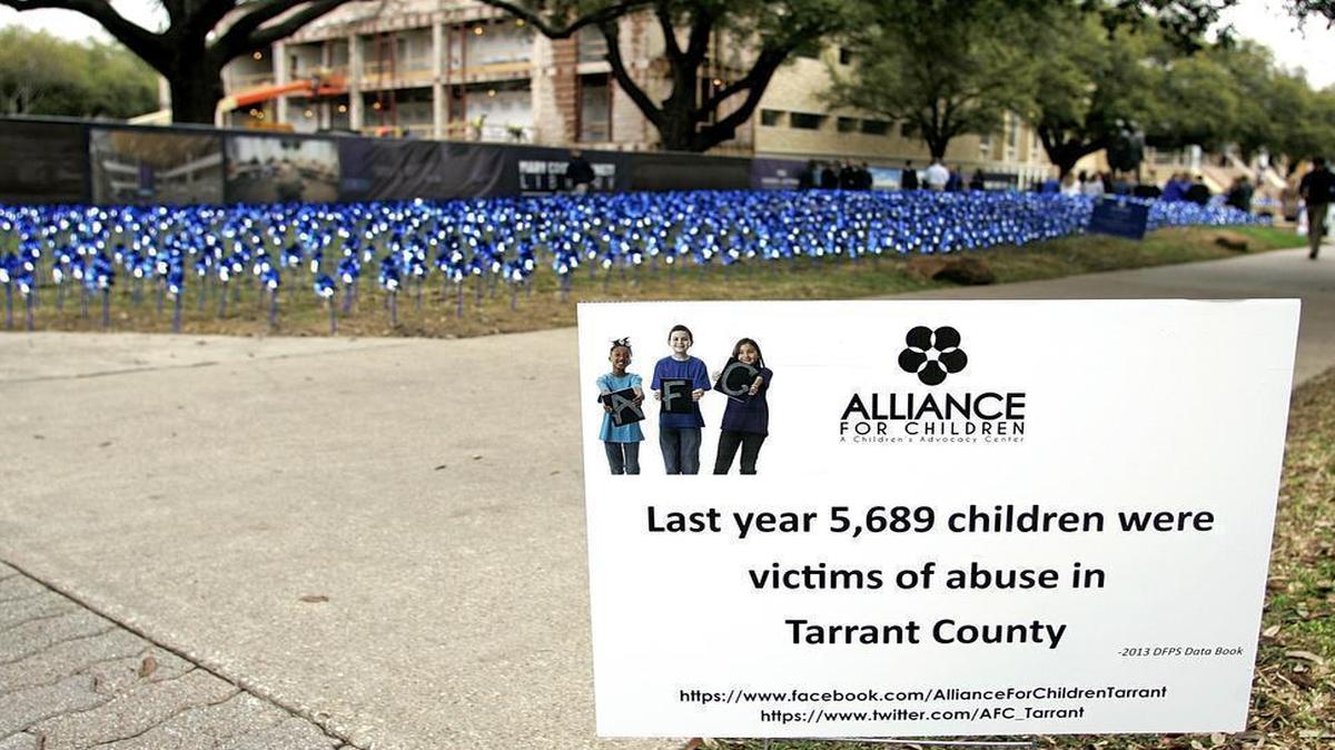 
Blue pinwheels in background were placed at TCU last year to raise awareness of child abuse. Alliance for Children placed a pinwheel for each of the 5,689 victims in Tarrant County.
