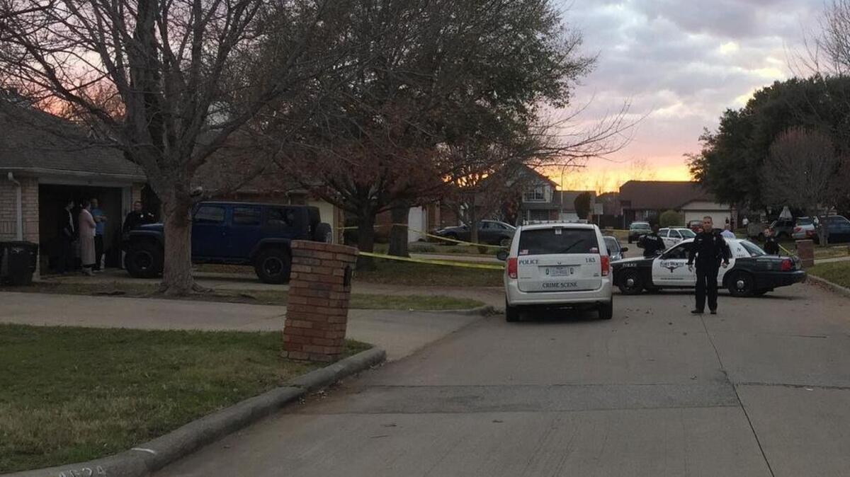 A Fort Worth police car blocks traffic in the 4600 block of Birchbend Lane after a man was fatally shot Tuesday.