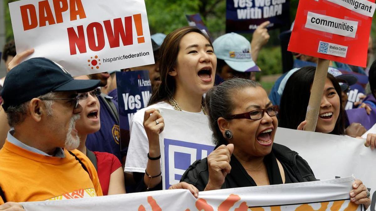 Demonstrators chant slogans during a National Day of Action to #Fight4DAPA rally, Tuesday, May 19, 2015, in New York. The demonstrators are demanding the end of a lawsuit that blocks a program to protect from deportation, parents of U.S. citizens or permanent residents. On Tuesday, the U.S. Supreme Court announced it would review the case. (AP Photo/Mary Altaffer)