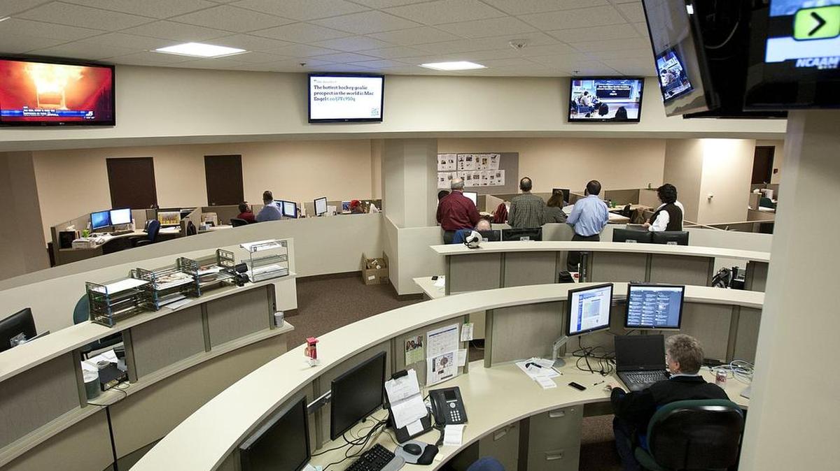 Star-Telegram staffers gather for an afternoon meeting in the Fort Worth newsroom.